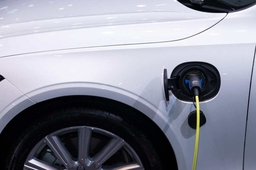 an electric car with charging plug attached