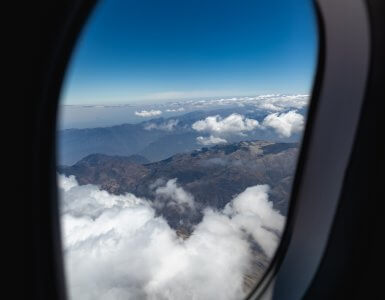 plane in flight showing window view
